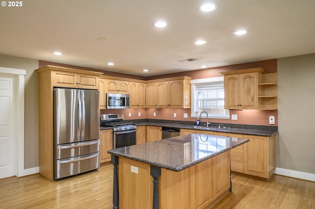 50 W Taylor St, Carlton, OR 97111 - kitchen featuring appliances with stainless steel finishes, a sink, baseboards, light wood finished floors, and recessed lighting