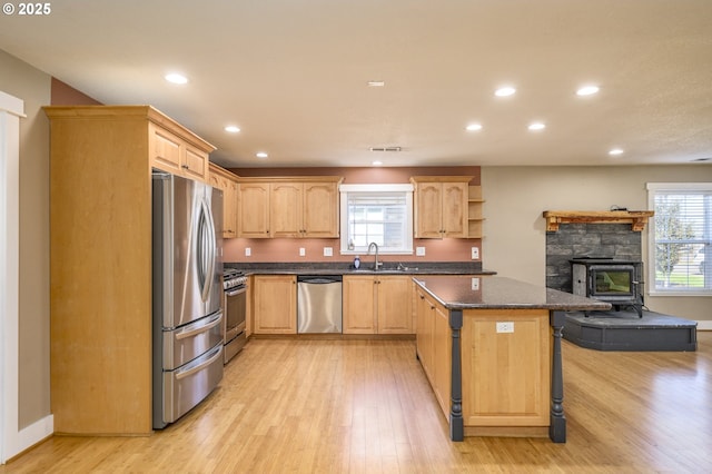 50 W Taylor St, Carlton, OR 97111 - kitchen with stainless steel appliances, a sink, light brown cabinets, light wood finished floors, and recessed lighting