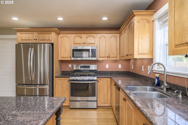50 W Taylor St, Carlton, OR 97111 - kitchen with appliances with stainless steel finishes, a sink, recessed lighting, light wood-type flooring, and dark stone countertops