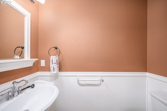 50 W Taylor St, Carlton, OR 97111 - bathroom with a wainscoted wall, a sink, and toilet