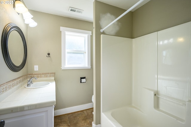 50 W Taylor St, Carlton, OR 97111 - full bathroom with vanity, baseboards, toilet, shower / bath combination, and tile patterned floors