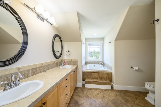 50 W Taylor St, Carlton, OR 97111 - bathroom with a tub with jets, double vanity, toilet, baseboards, and tile patterned flooring