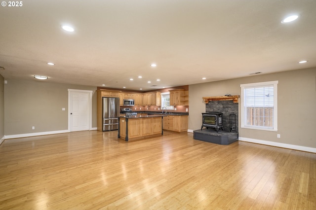 50 W Taylor St, Carlton, OR 97111 - kitchen featuring appliances with stainless steel finishes, open floor plan, baseboards, and recessed lighting