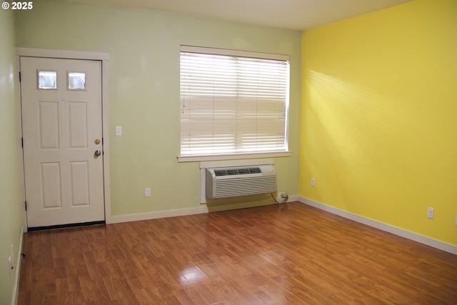 608 NE Roydon Ln, Hillsboro, OR 97006 - foyer featuring wood finished floors and a wall unit AC