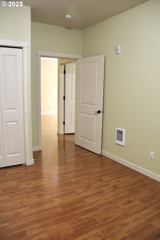 608 NE Roydon Ln, Hillsboro, OR 97006 - spare room featuring wood finished floors and a smoke detector