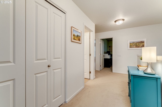 corridor with light colored carpet