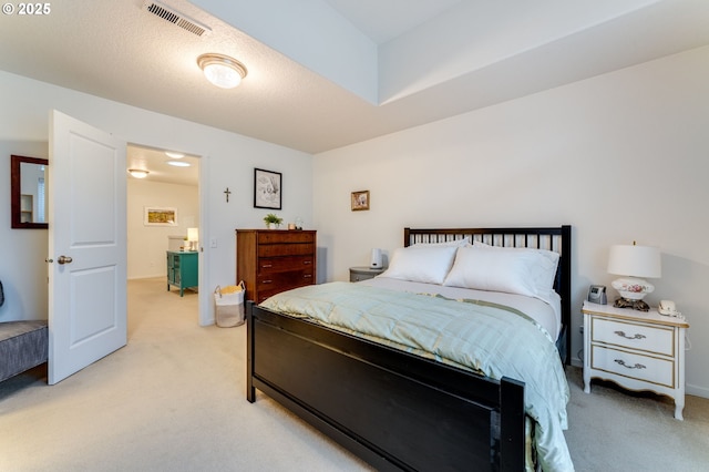 carpeted bedroom with a textured ceiling