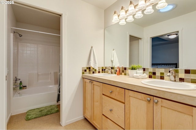 bathroom with vanity, decorative backsplash, and bathing tub / shower combination