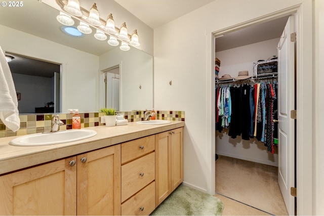 bathroom with vanity and backsplash