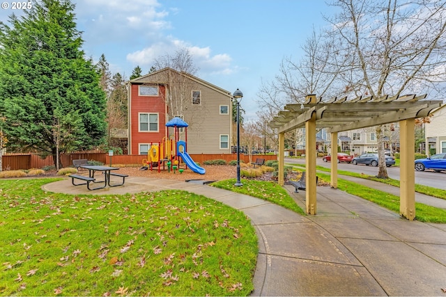 view of jungle gym with a yard and a pergola