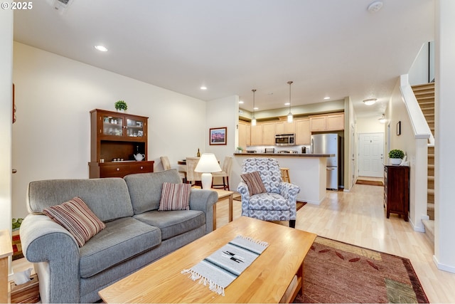 living room with light hardwood / wood-style floors