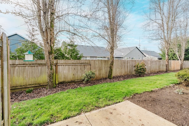 view of yard with a fenced backyard