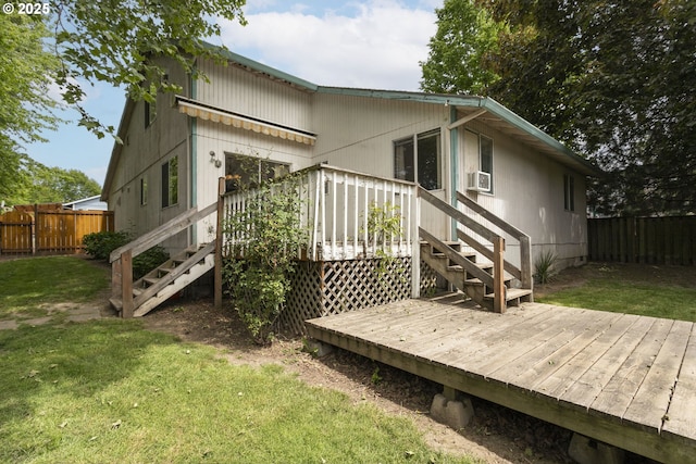 back of property with stairway, a wooden deck, and cooling unit