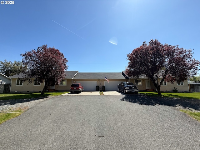 3000 Elm St, Baker City, OR 97814 - view of front facade featuring an attached garage and asphalt driveway