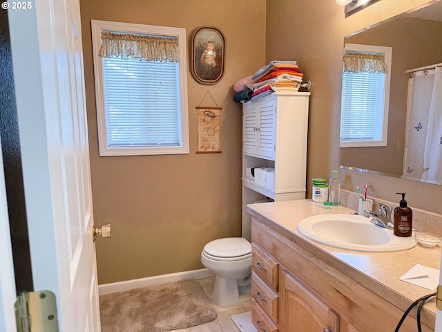3000 Elm St, Baker City, OR 97814 - bathroom featuring vanity, toilet, healthy amount of natural light, and tile patterned floors