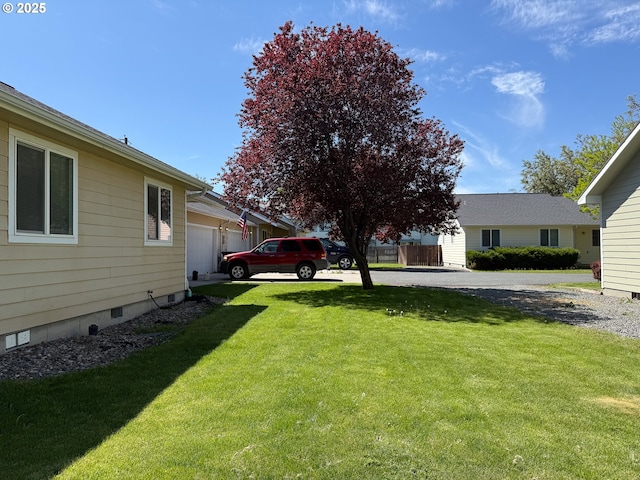 3000 Elm St, Baker City, OR 97814 - view of green lawn with an attached garage and driveway