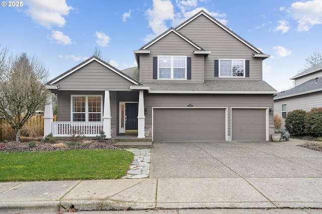 view of front facade featuring a front yard, covered porch, and a garage