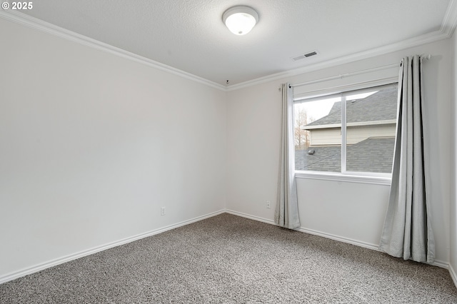 carpeted spare room featuring a textured ceiling and crown molding