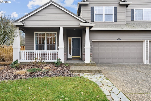 view of front facade with a porch and a garage