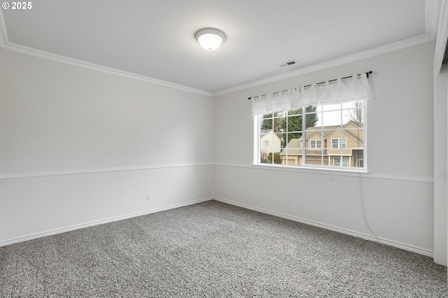 empty room with a textured ceiling and crown molding