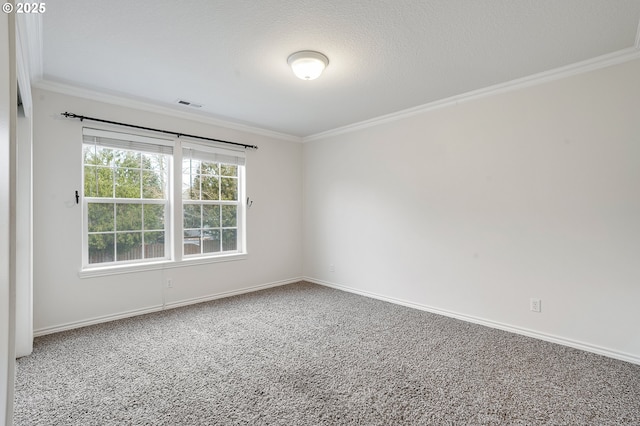 carpeted empty room featuring a textured ceiling and crown molding