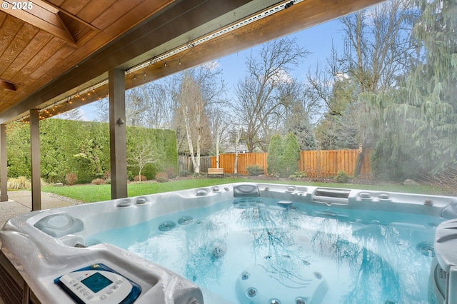 view of pool with a hot tub