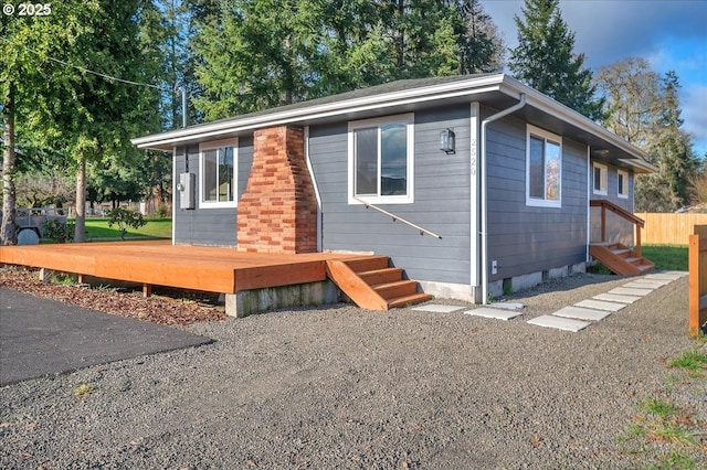 view of front of property featuring a wooden deck