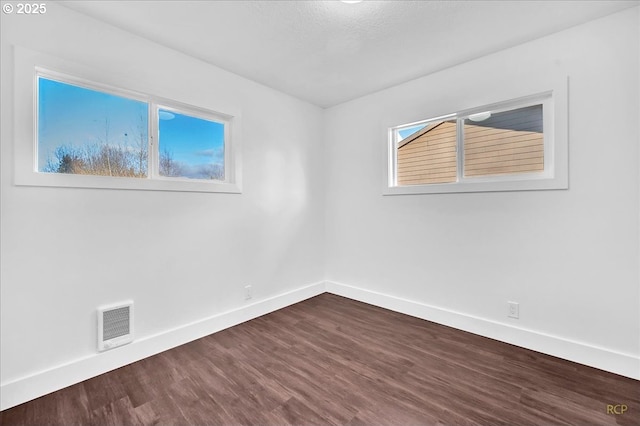 empty room featuring hardwood / wood-style flooring