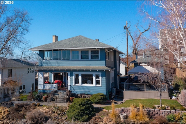 view of front of house with a gazebo and a chimney