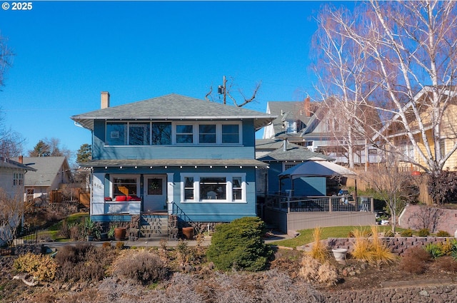 view of front of property with a chimney