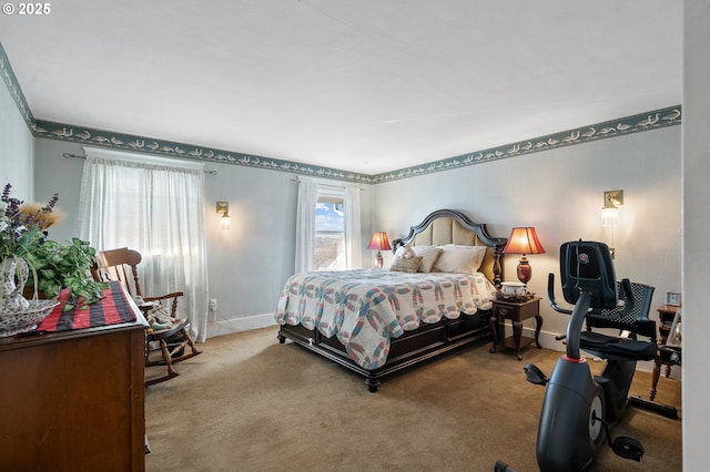 bedroom featuring baseboards and carpet flooring