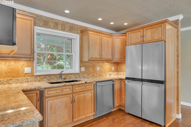 11675 SW Lynn St, Portland, OR 97223 - kitchen featuring appliances with stainless steel finishes, a sink, crown molding, dark wood finished floors, and light stone counters