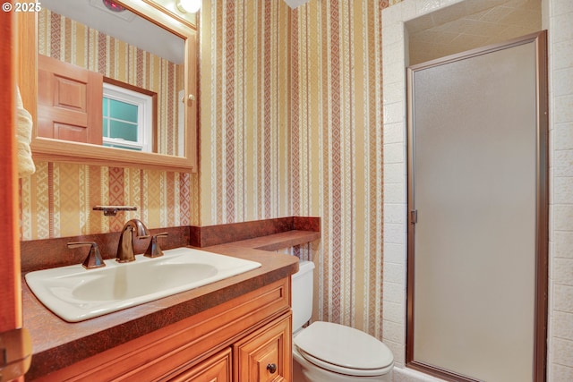 11675 SW Lynn St, Portland, OR 97223 - bathroom featuring wallpapered walls, toilet, a stall shower, and vanity