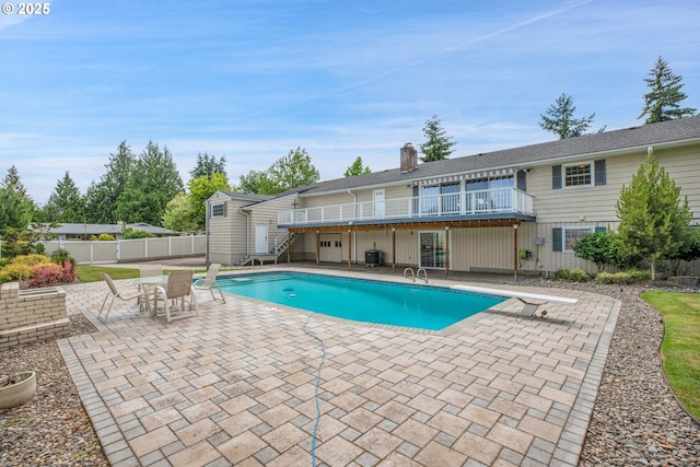 11675 SW Lynn St, Portland, OR 97223 - view of pool with a wooden deck, a patio area, a diving board, and stairway