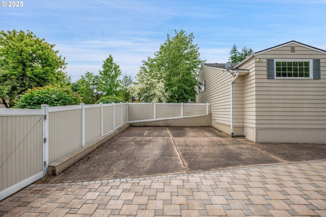 11675 SW Lynn St, Portland, OR 97223 - fenced backyard with a patio and a gate