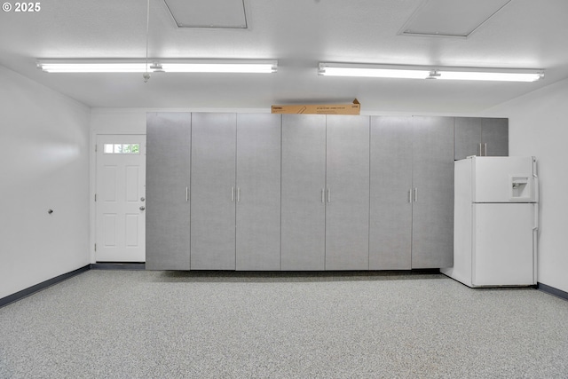 11675 SW Lynn St, Portland, OR 97223 - garage with white fridge with ice dispenser and baseboards