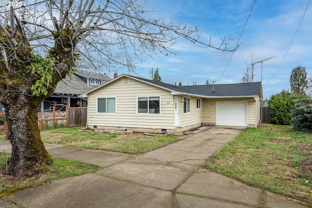 view of front of property featuring a front yard, crawl space, fence, a garage, and driveway