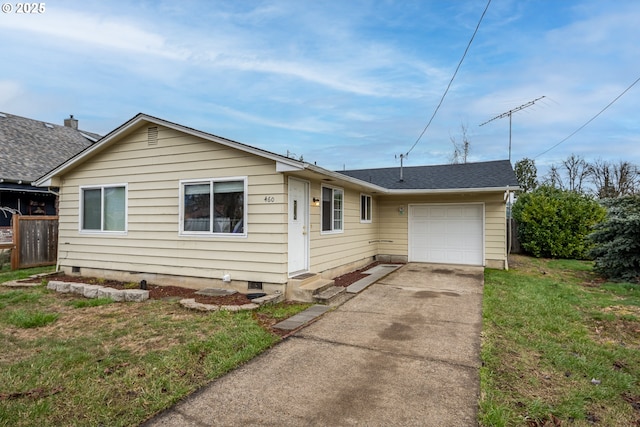 view of front of house featuring a garage, entry steps, concrete driveway, roof with shingles, and a front yard