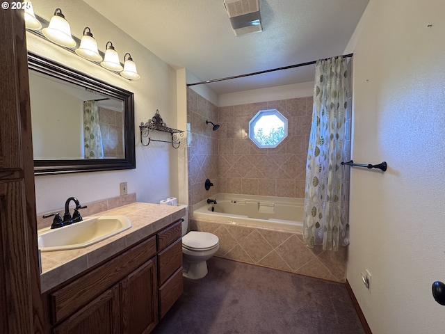 full bathroom featuring shower / tub combo with curtain, vanity, and toilet