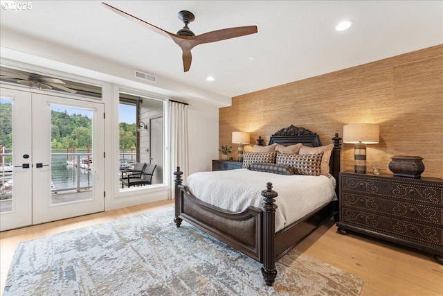 525 SE Marion St # 2, Portland, OR 97202 - bedroom with access to outside, wood finished floors, recessed lighting, french doors, and ceiling fan
