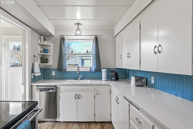 1538 Grove St, Eugene, OR 97404 - kitchen featuring dishwasher, a sink, light countertops, tasteful backsplash, and plenty of natural light