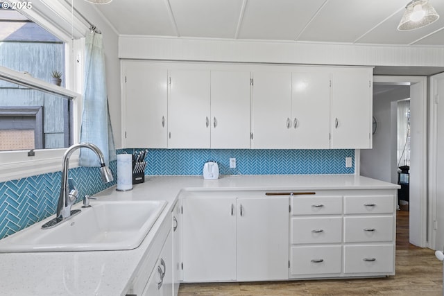1538 Grove St, Eugene, OR 97404 - kitchen featuring a sink, backsplash, and light countertops