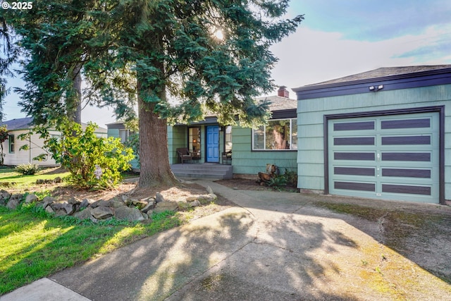 1538 Grove St, Eugene, OR 97404 - view of front of property featuring concrete driveway and an attached garage