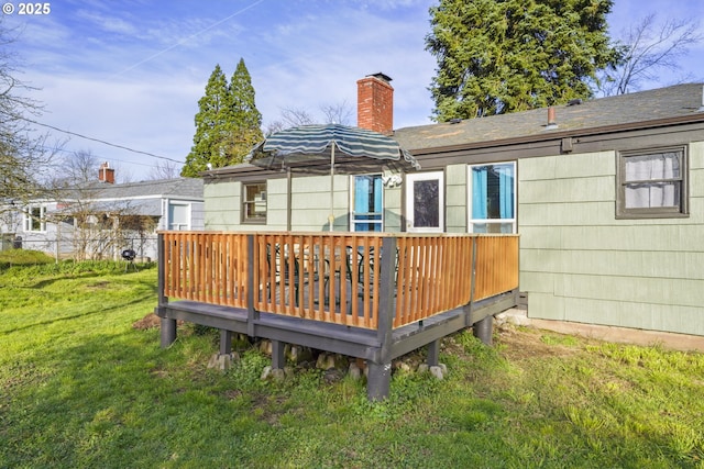 1538 Grove St, Eugene, OR 97404 - back of house featuring a chimney, a yard, and a deck