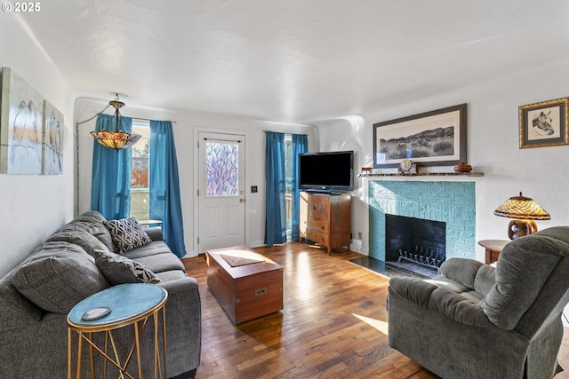 1538 Grove St, Eugene, OR 97404 - living room featuring wood finished floors and a brick fireplace
