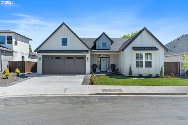 6709 NW 24th Ct, Vancouver, WA 98665 - modern farmhouse style home with board and batten siding, a standing seam roof, driveway, roof with shingles, and metal roof