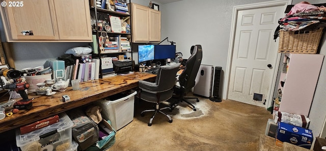 office featuring concrete floors and a workshop area