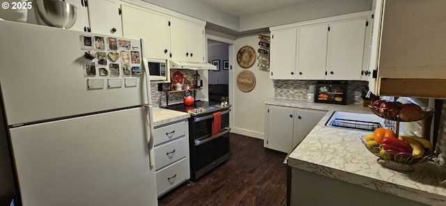 kitchen with dark hardwood / wood-style floors, white cabinetry, backsplash, and white appliances