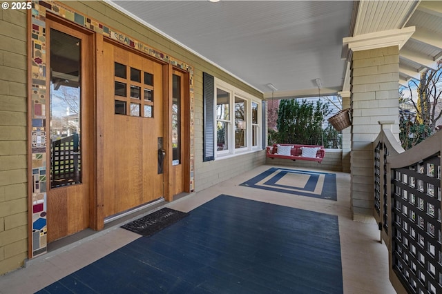 doorway to property featuring a porch