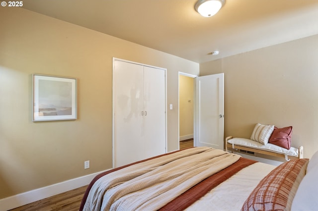 4770 SW Beech Dr, Beaverton, OR 97005 - bedroom with wood finished floors, baseboards, and a closet